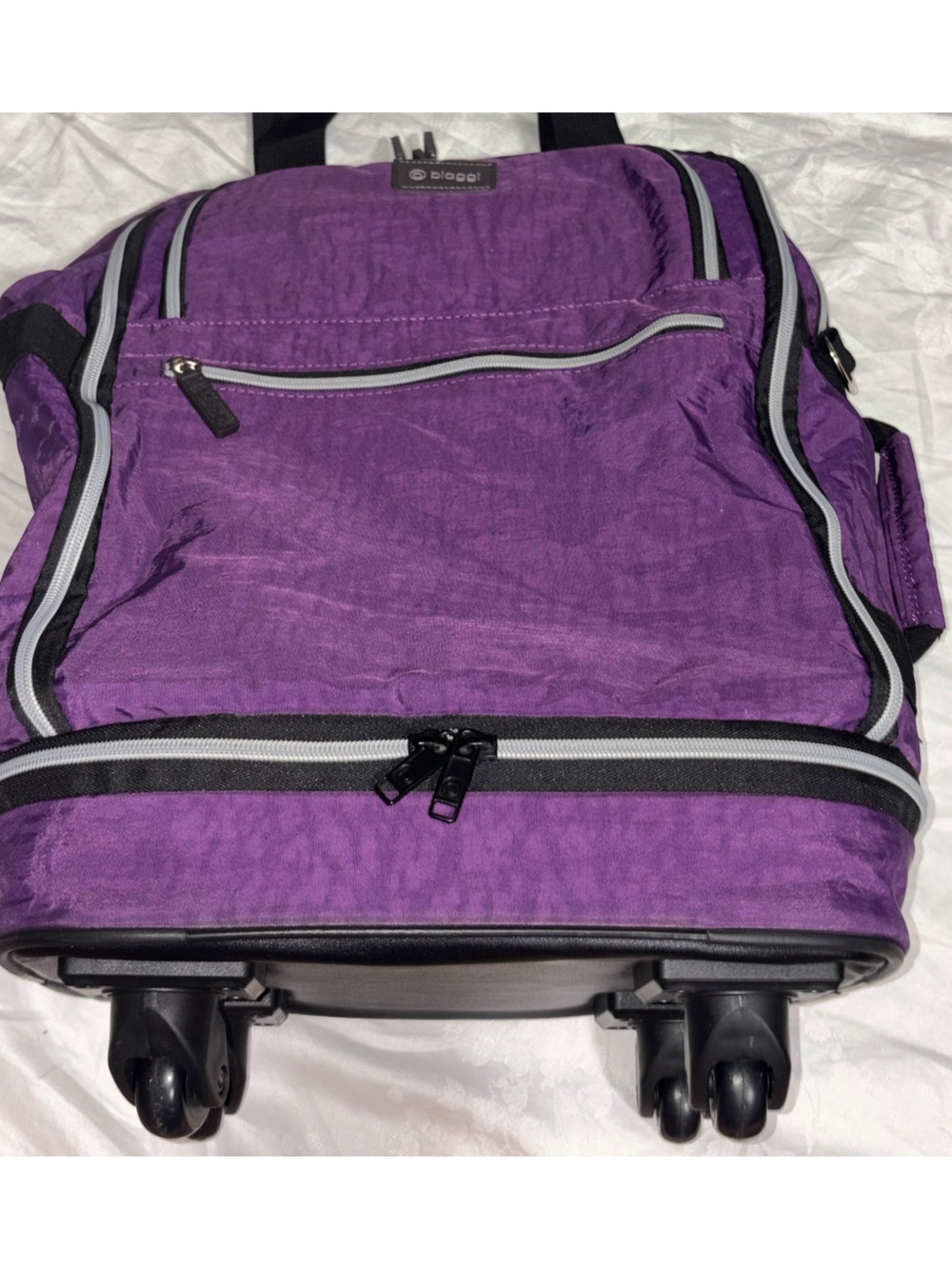 Like new Biaggi zipsak boost Underseater purple rolling luggage